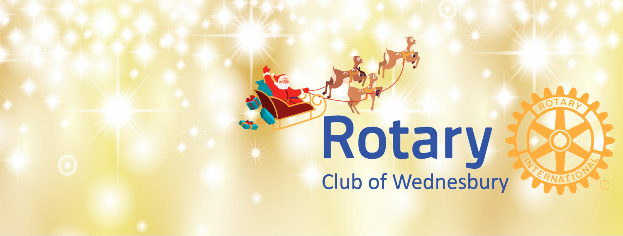 Santa Claus rides his sleigh high above the Rotary Club of Wednesbury logo.